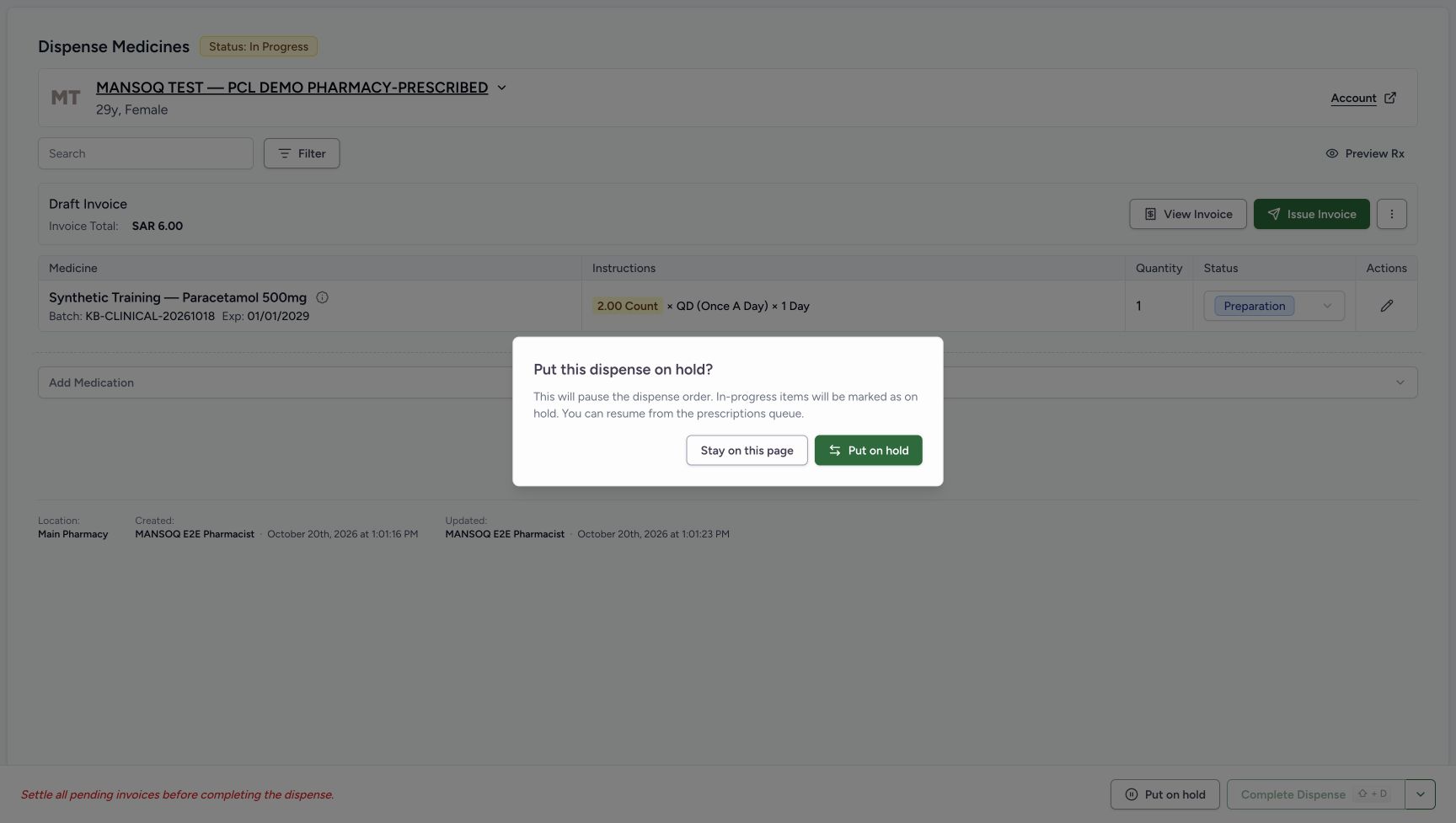 Put this dispense on hold confirmation is open over the unchanged order, with explanation text, Stay on this page and Put on hold controls.